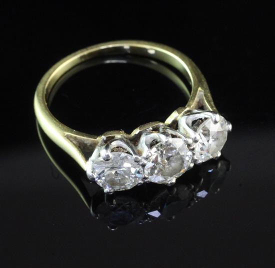 A gold and three stone diamond ring, size K.